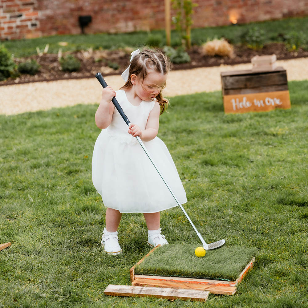 Hole in One: Precision-based wooden golf putting challenge (Hole in One) for carnival-themed event hire.
